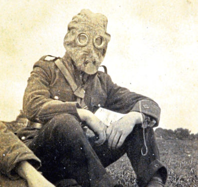 A Gordon Highlander wearing a gas mask