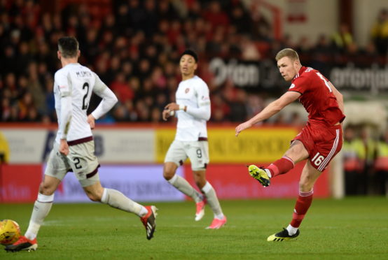 Aberdeen's Sam Cosgrove has a shot against Hearts at Pittodrie.
Picture by Darrell Benns.