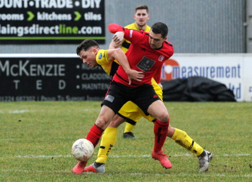 Picture of Wick's Jack Henry (left) and Inverurie's Neil McLean
Picture by KENNY ELRICK