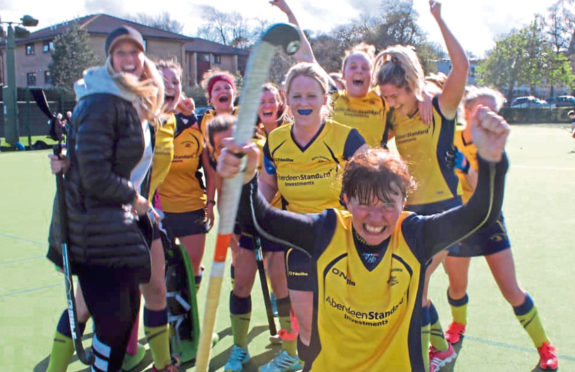 Merlins Gordonians celebrate their promotion.