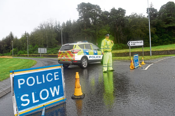 Police at the scene of the accident on the A98