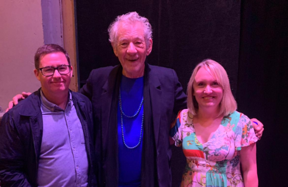 Sir Ian McKellen with staff at the theatre