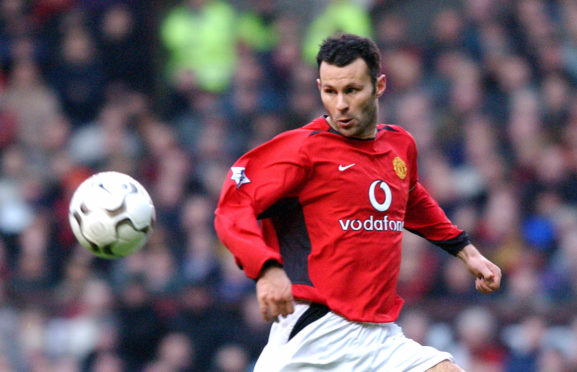 Giggs in action for Manchester United in 2002