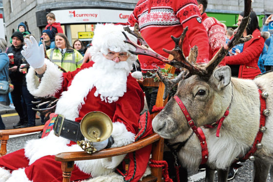 Santa and one of his reindeer during last year's parade