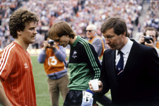 Ferguson, right, with Bell at the 1984 final. The boss was famously furious after the Dons lifted the trophy in 1983.