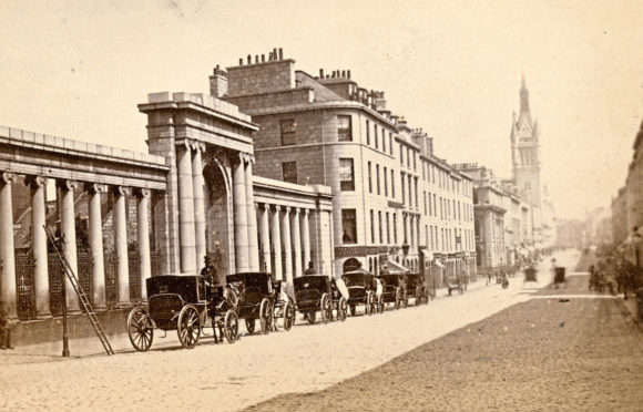 A view of Union Street by George Washington Wilson and Son, dating from around 1872, showing the colonnade
entrance to the Kirkyard of St Nicholas