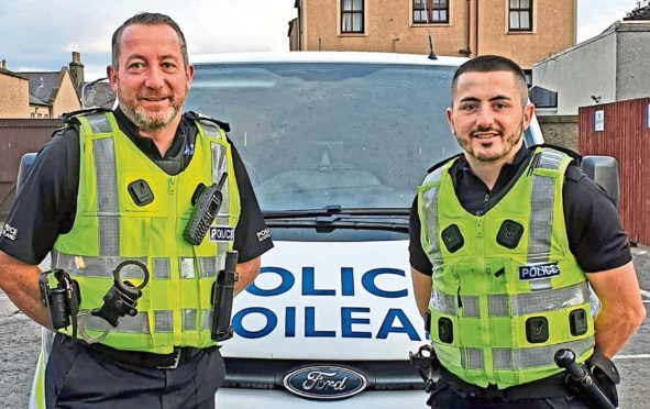 Retiring Moray Sergeant Ally Bruce with his son PC Harry Bruce