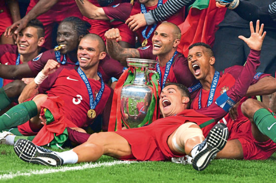 The Portugal team with the trophy in 2016