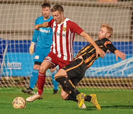 Formartine Michael Clark and Huntly's Ross Still.