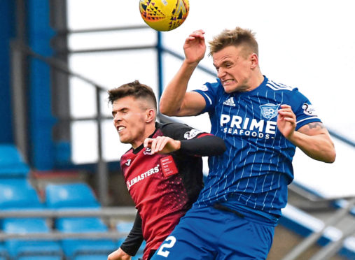 Jason Brown clears from Paul McKay