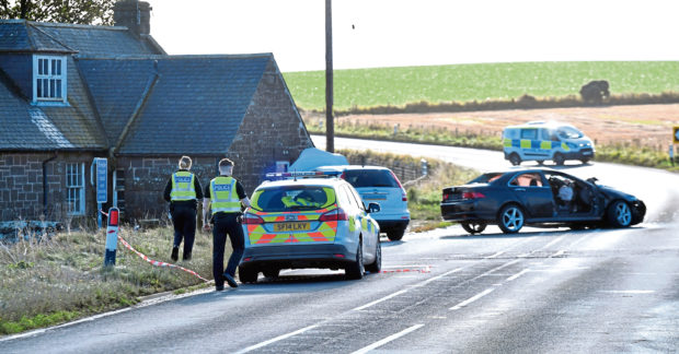 Police at the scene of the collision on the A92
