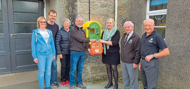 The Milne Hall committee with volunteers from St Johns Ambulance Scotland