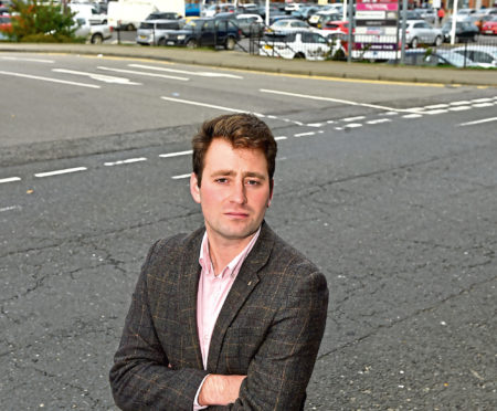 Cllr Michael Hutchison at the junction