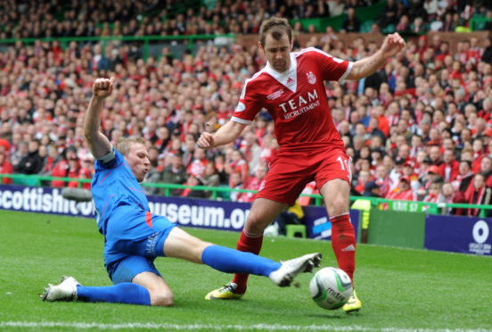 Inverness' Richie Foran and Aberdeen's Niall McGinn during the 2014 League Cup final.