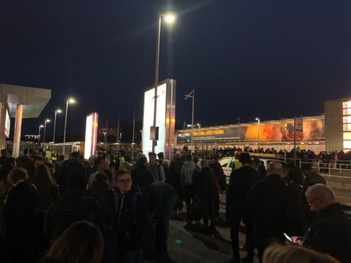 Passengers outside Aberdeen International Airport tonight