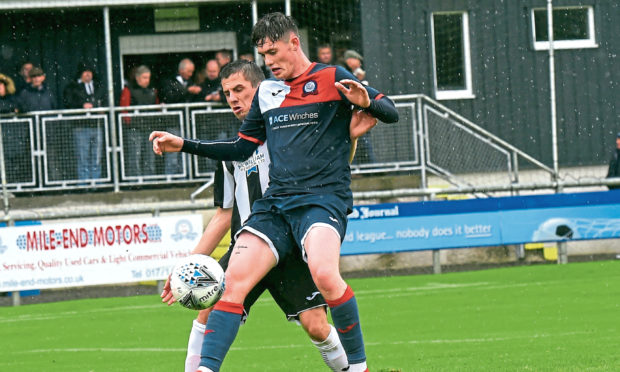 Turriff United's Keir Smith, centre.