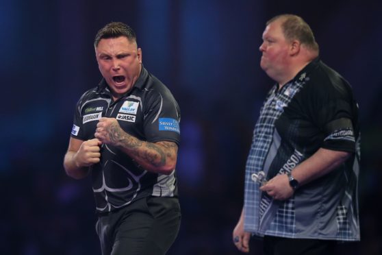 Gerwyn Price (Wales) reacts during his Third Round game against John Henderson (Scotland) during the PDC William Hill World Darts Championship at Alexandra Palace, London.