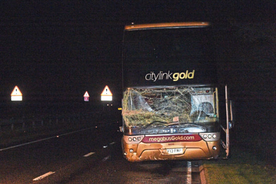 A witness told the court the car driven by the accused drove straight out into the path of a double-decker bus