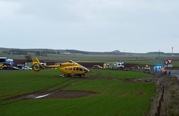 Emergency services at the scene of the fatal crash on the A90