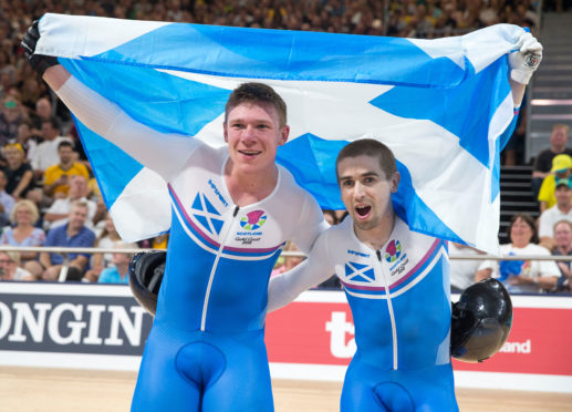 Cycling Neil Fachie and Matt Rotherham celebrate winning at Gold Coast 2018.