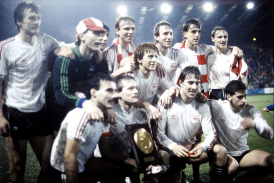 Aberdeen's players celebrate their Super Cup triumph in 1983.
Back row (l to r): Dougie Bell, Jim Leighton, John Hewitt, Alex McLeish, Neil Simpson, Peter Weir, Stewart McKImmie
Front row (l to r): Willie Miller, John McMaster, Gordon Strachan, Mark McGhee, Eric Black