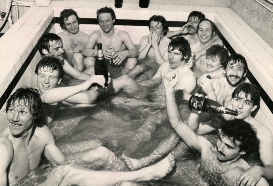 Aberdeen's class of 1979/80 drinking champagne in the bath at Easter Road, From bottom left, clockwise, Doug Rougvie, Alex McLeish, Andy Watson, Roland Arnott (physio), John McMaster, Gordon Strachan, Stuart Kennedy, Drew Jarvie, Bobby Clark, Doug Bell, Ian Scanlon, Mark McGhee, Willie Miller.