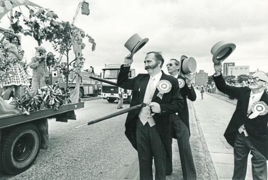 The Lords of Bon-Accord Bernard Balfour, Henry Balfour and Bob Findlay salute the floats