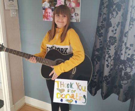 Hayley Fraser is strumming her guitar in aid of NHS frontline workers