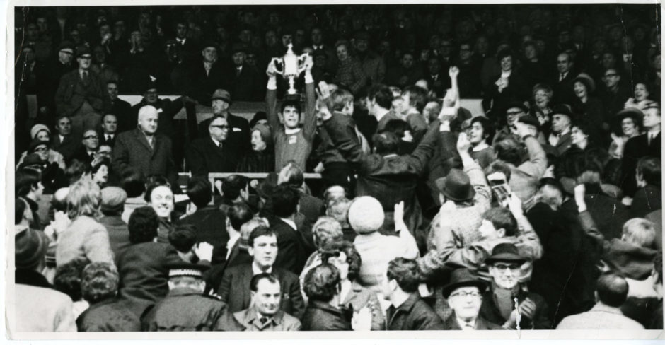 Martin Buchan, Aberdeen FC captain, holds aloft the Scottish Cup having beaten Celtic FC 3-1 at Hampden Park, Glasgow.