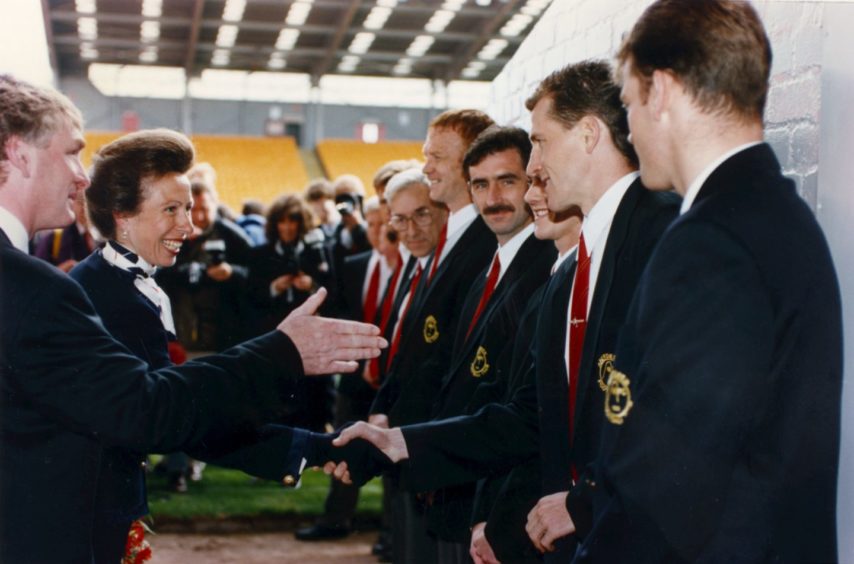 The Princess Royal was highly amused when she opened the Richard Donald stand at Pittodrie in 1993. Here she meets Dons defender Brian Irvine as Aberdeen FC vice-chairman Ian Donald introduces her to the staff and players.