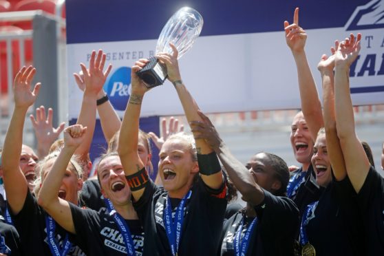 Houston Dash lifted the trophy.