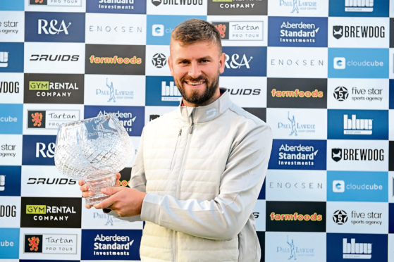 John Henry with his trophy.
Picture by Darrell Benns