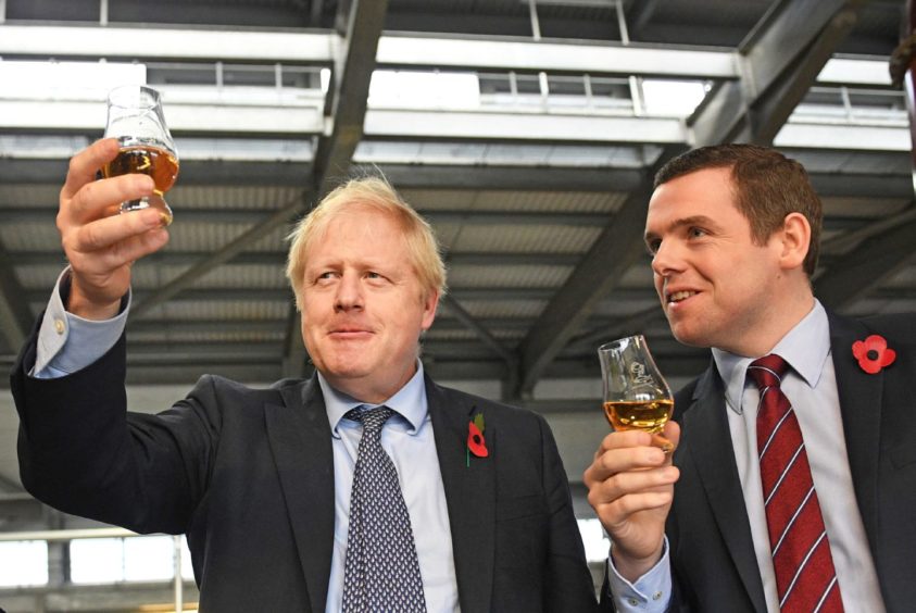 Douglas Ross, right, the front-runner to become Scottish Tory leader, with Boris Johnson.