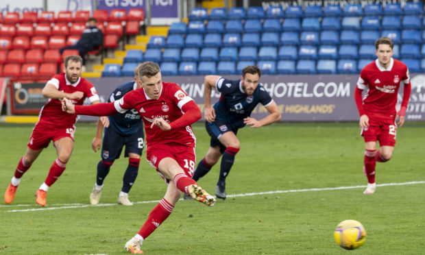 Lewis Ferguson scores a penalty