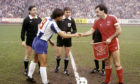 Aberdeen captain Willie Miller shakes hands with the Porto captain Fernando Gomes ahead of the second leg of the European Cup Winners' Cup semi-final at Pittodrie in 1984.
