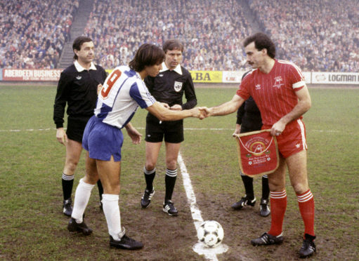 Aberdeen captain Willie Miller shakes hands with the Porto captain Fernando Gomes ahead of the second leg of the European Cup Winners' Cup semi-final at Pittodrie in 1984.