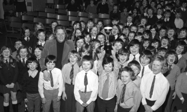 Soccer legend Denis Law was back at school, and presented the new trophy bearing his name to the footballing heroes of Aberdeen's Cornhill Primary.
