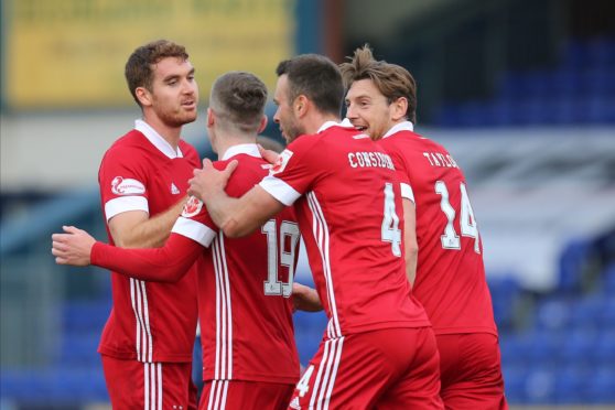 Aberdeen celebrate their third.