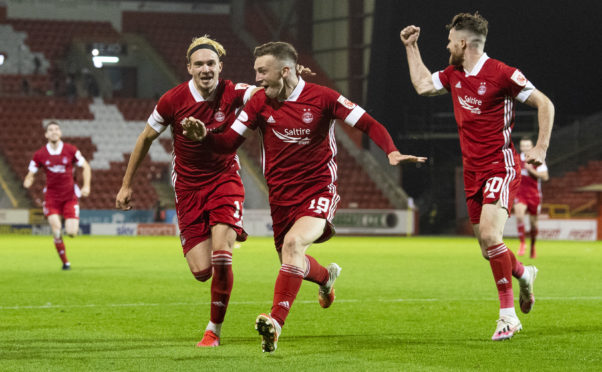Lewis Ferguson, centre, celebrates after scoring the winner against St Mirren in the home league game against the Buddies.