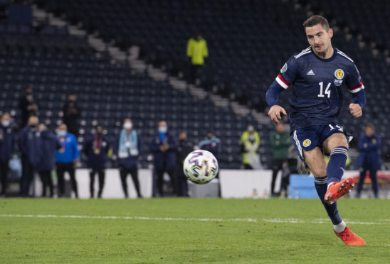 Kenny McLean scores the winning penalty for Scotland against Israel at Hampden.