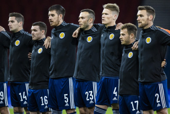 Considine, third from left, lines up for Scotland before the game on Sunday.