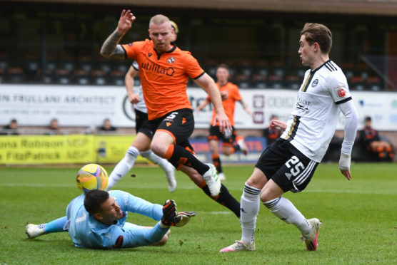 Aberdeen's Scott Wright chips the ball over Dundee United goalkeeper Benjamin Siegrist - only to be denied on the line.