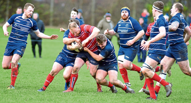 Greig Ryan in the heart of battle for Aberdeen Grammar.
