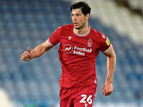 Former Aberdeen defender Scott McKenna is back in the Scotland squad after injury