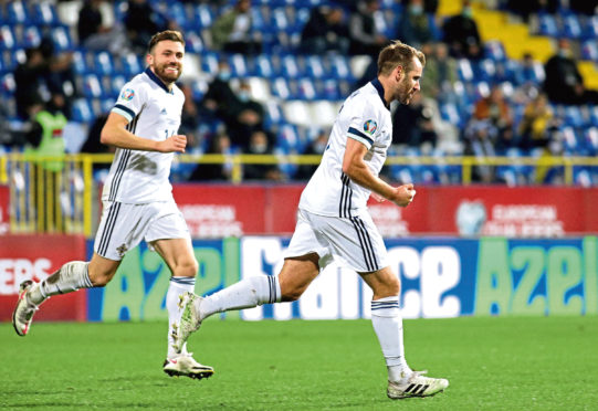 Niall McGinn celebrates his strike.