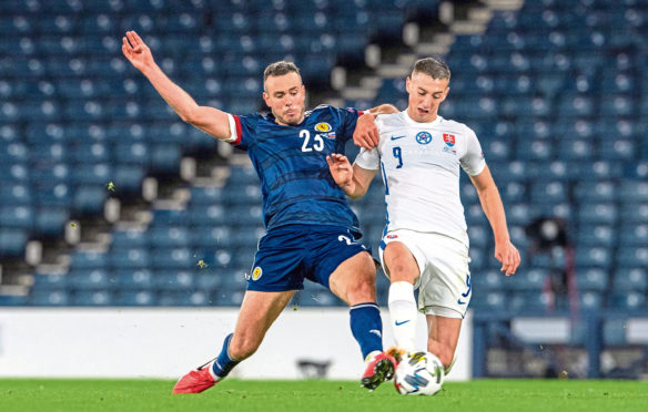 Andy Considine playing for Scotland against Slovakia.