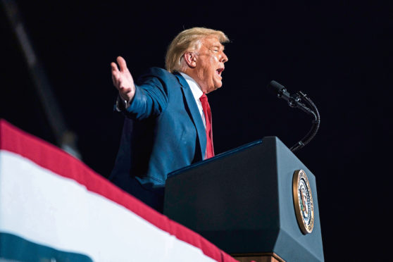 President Donald Trump speaks during a campaign rally at Gastonia Municipal Airport, Wednesday, Oct. 21, 2020, in Gastonia, N.C. (AP Photo/Evan Vucci)