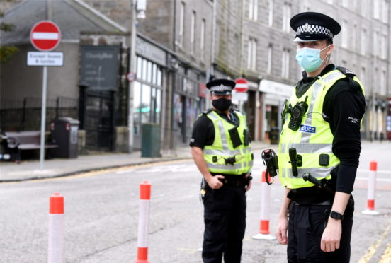 Pictured are officer Darren Gibbs, left, and Marc Davidson on Rosemount Place, Aberdeen.