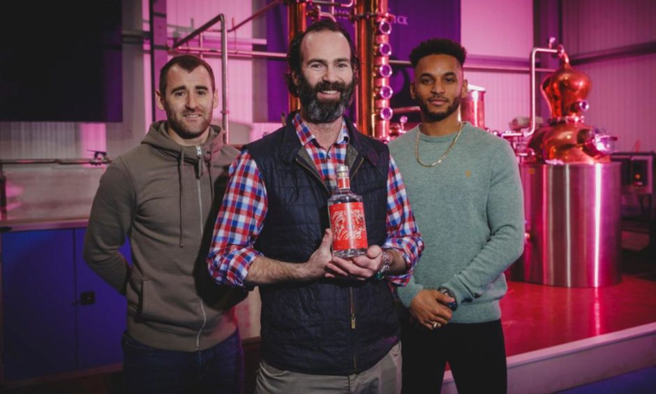 AFC players Niall McGinn and Funso Ojo with Stuart Ingram of House of Elrick