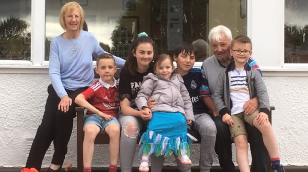 Pictured is Dave Johnstone with wife Susan and, from left, their grandchildren Liam, Lilly, Aimee, Andrew and Blair.